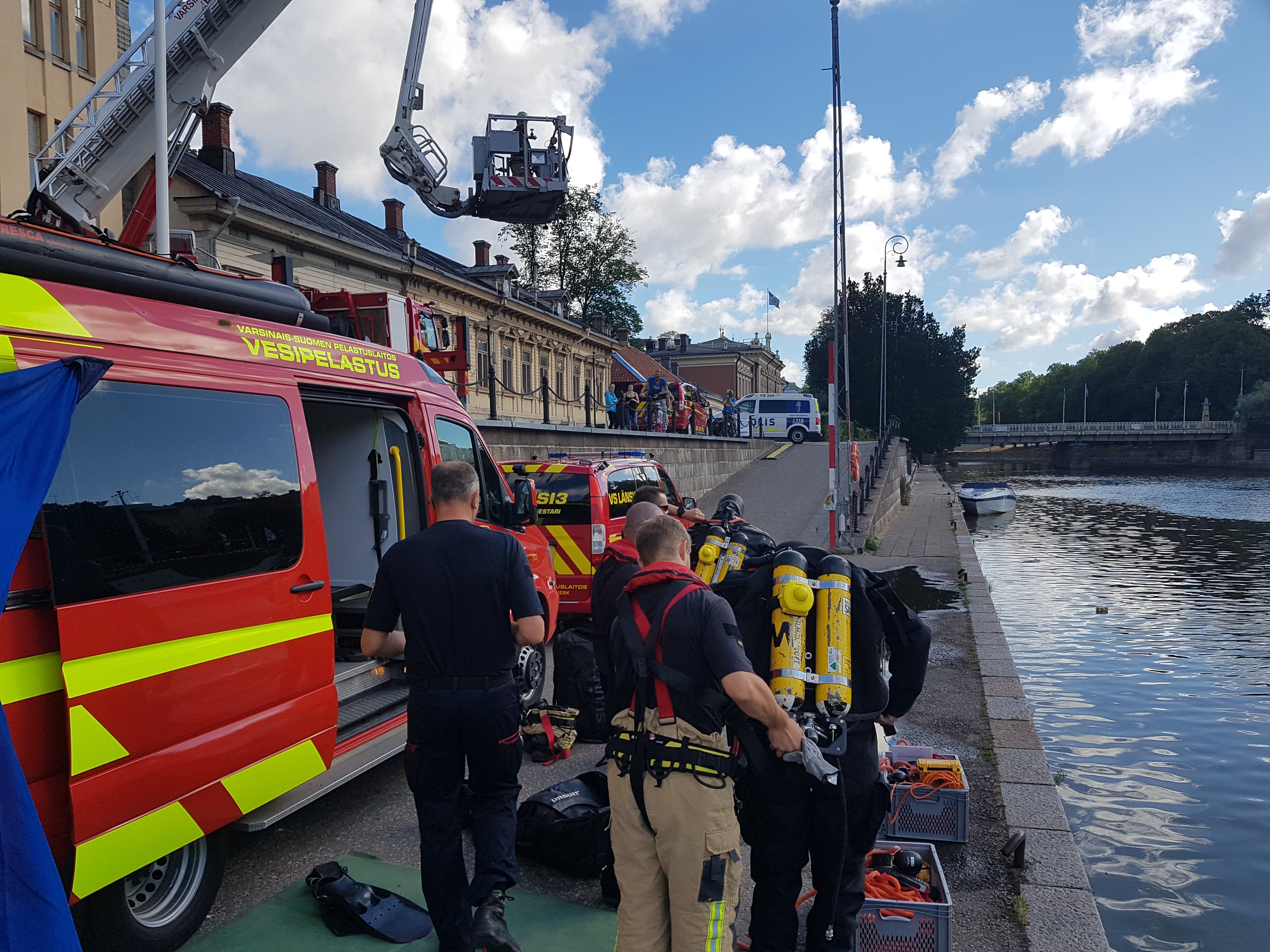 Rescue team and equipment on the bank of the Aura River